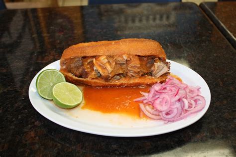 While the chiles soak, place the tomatoes on a large baking sheet. . Tortas ahogadas near me